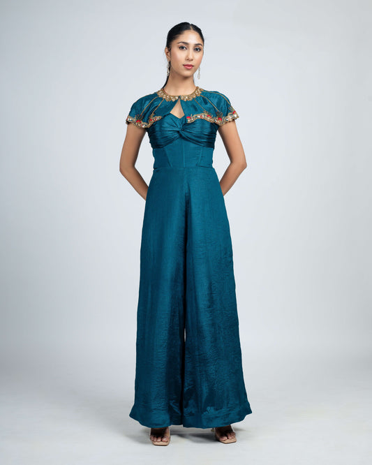 Pleated corset jumpsuit with shoulder cape