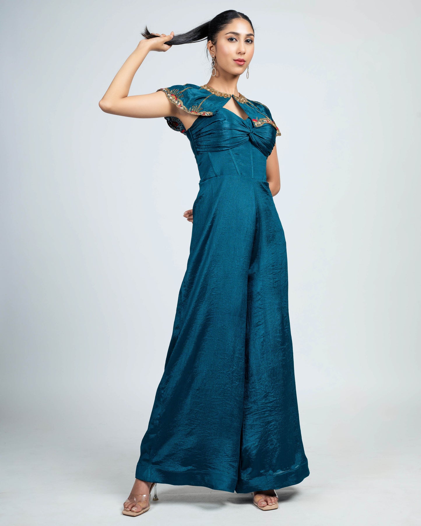 Pleated corset jumpsuit with shoulder cape