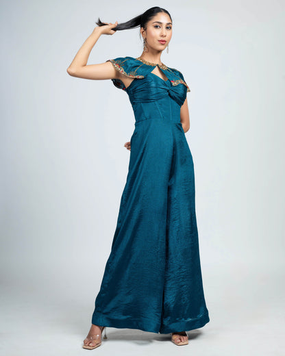 Pleated corset jumpsuit with shoulder cape